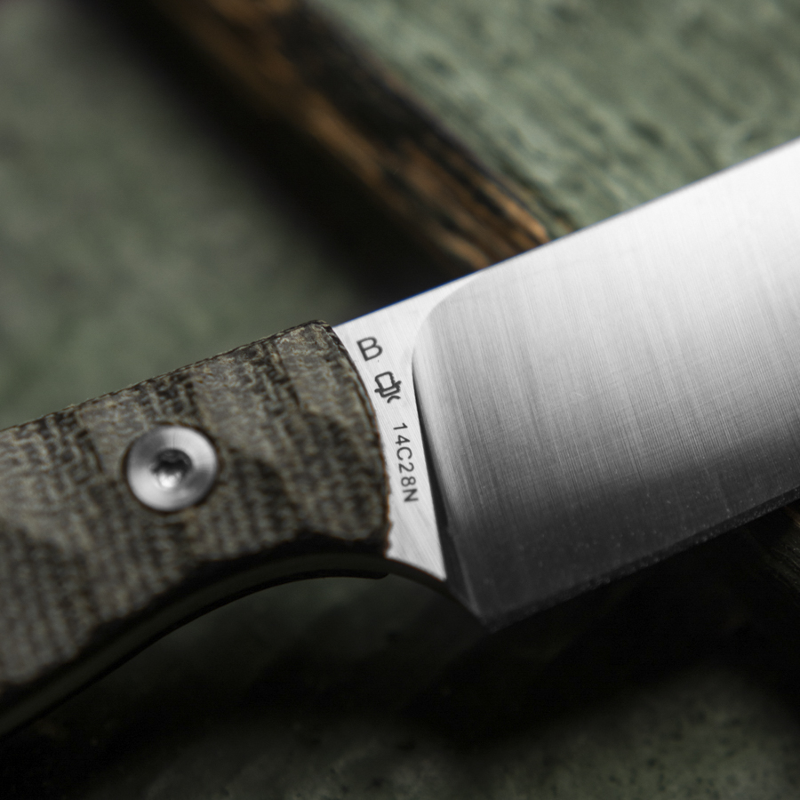 Close-up of the blade and black micarta handle with groove pattern and Knife Lounge logo on the Heidi #3 fixed blade knife